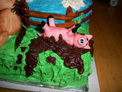 Pig rolling in chocolate mud
