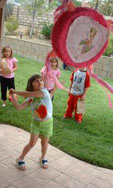 outdoor child birthday party games - pinata