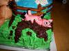 Pig rolling in chocolate mud